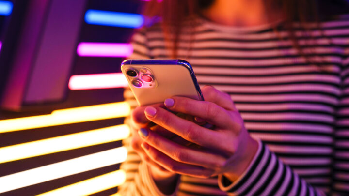 a woman holding a phone