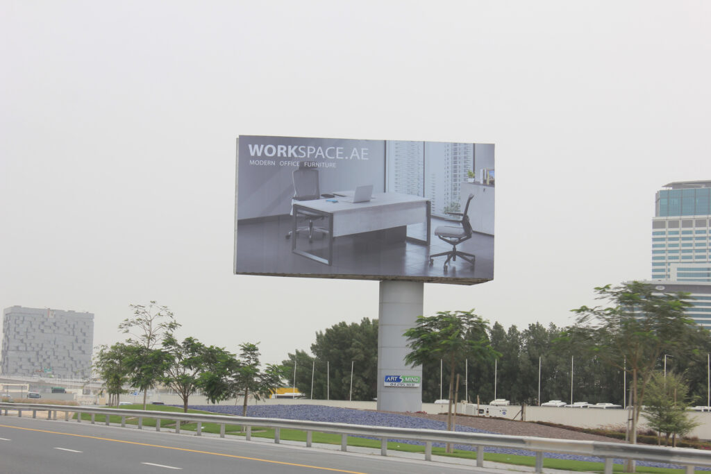 a billboard on the side of the highway